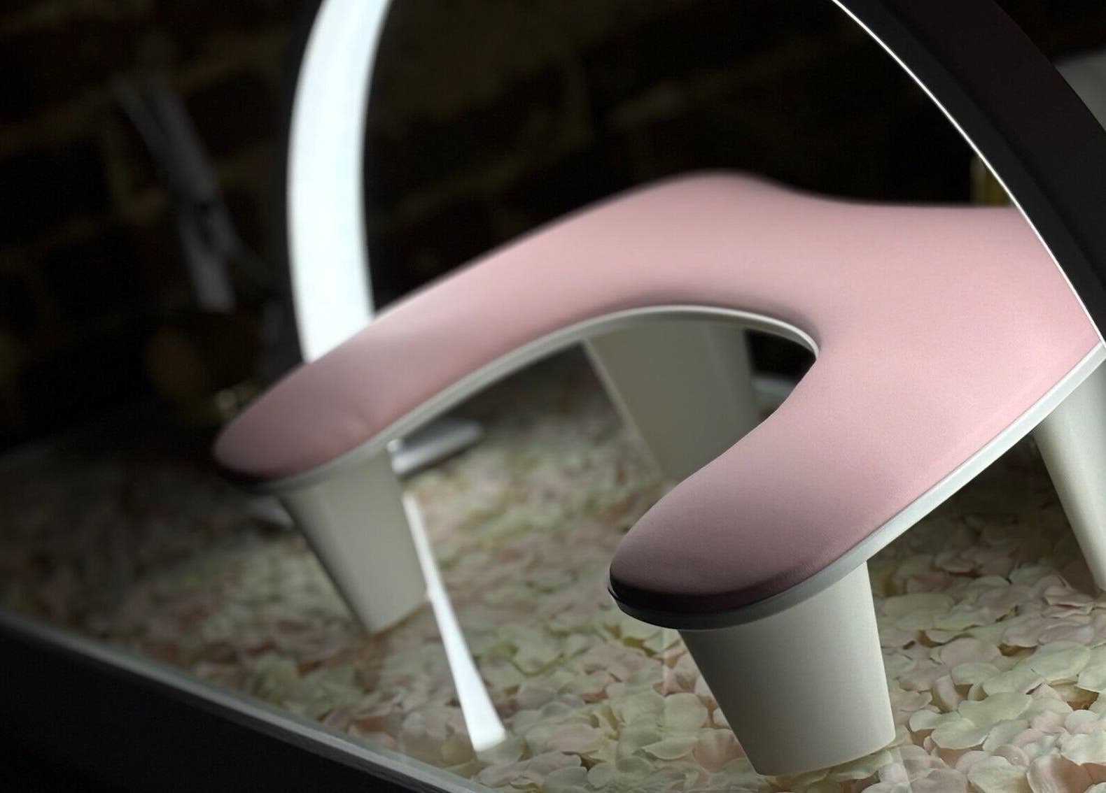 Elegant pink pedicure chair at The Blossom Clinic in Beccles, England, GB surrounded by rose petals.