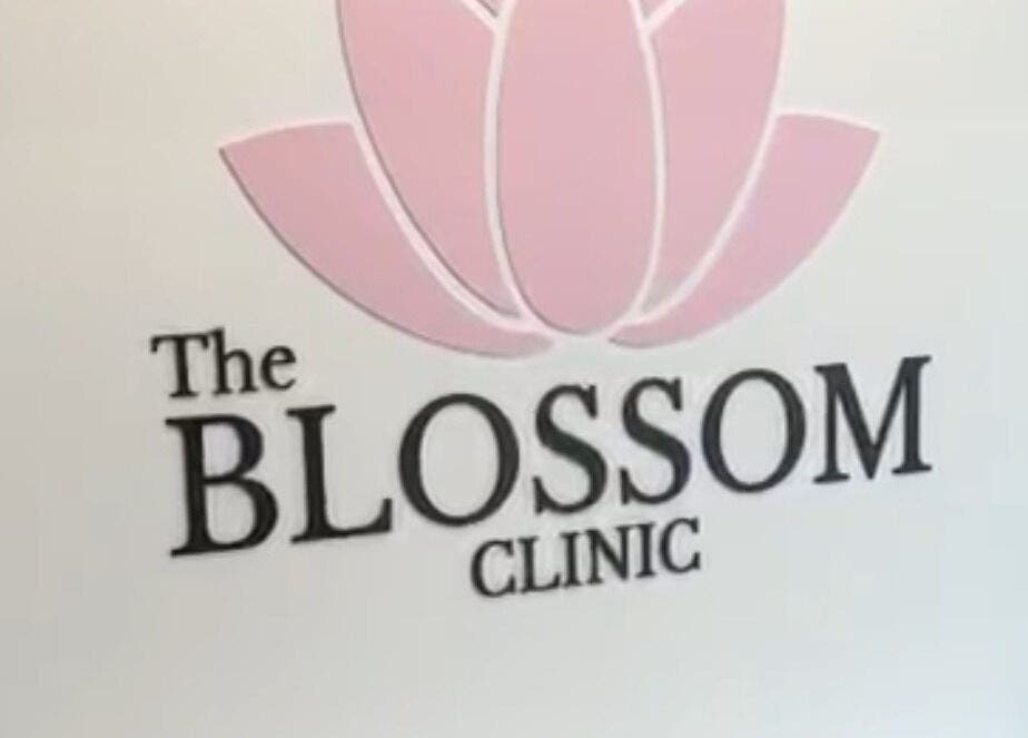 The Blossom Clinic logo with pink flower, located in Beccles, England, GB.
