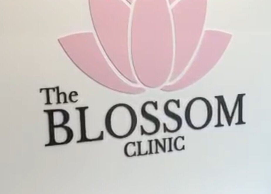 The Blossom Clinic logo with pink flower, located in Beccles, England, GB.