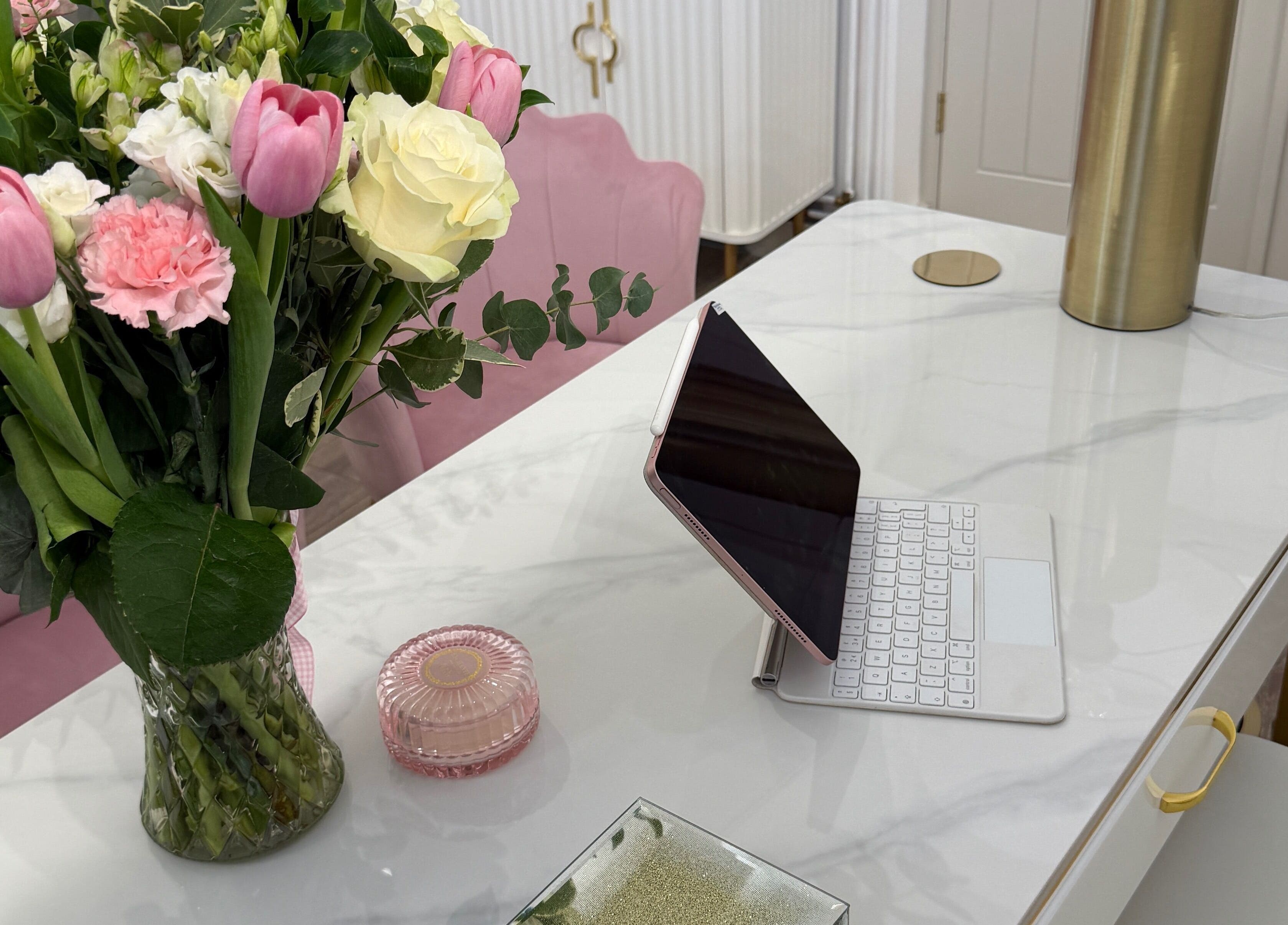 Elegant marble desk with flowers and a tablet at The Blossom Clinic, Beccles, England, GB.