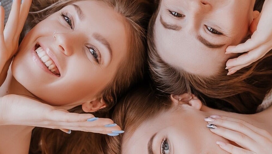 Three smiling women with glowing skin at Casa de luxe Los Angeles, Los Angeles, California, US.