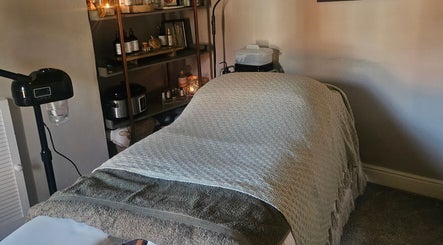 Tranquil massage room at Healing Hands with Alli, Grantham, England, GB, featuring cozy linens and ambient lighting.