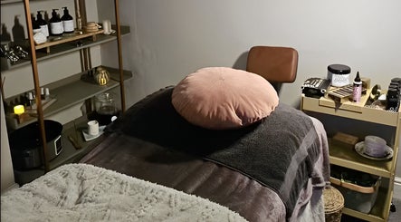 Relaxing massage room at Healing Hands with Alli, Grantham, England, GB with cozy decor and wellness products.