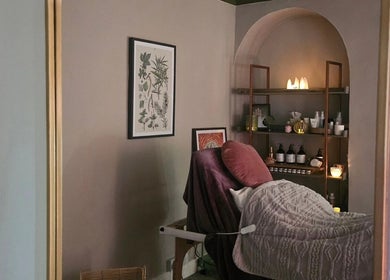 Relaxing treatment room at Healing Hands with Alli, Grantham, England, GB, with candles and artwork.