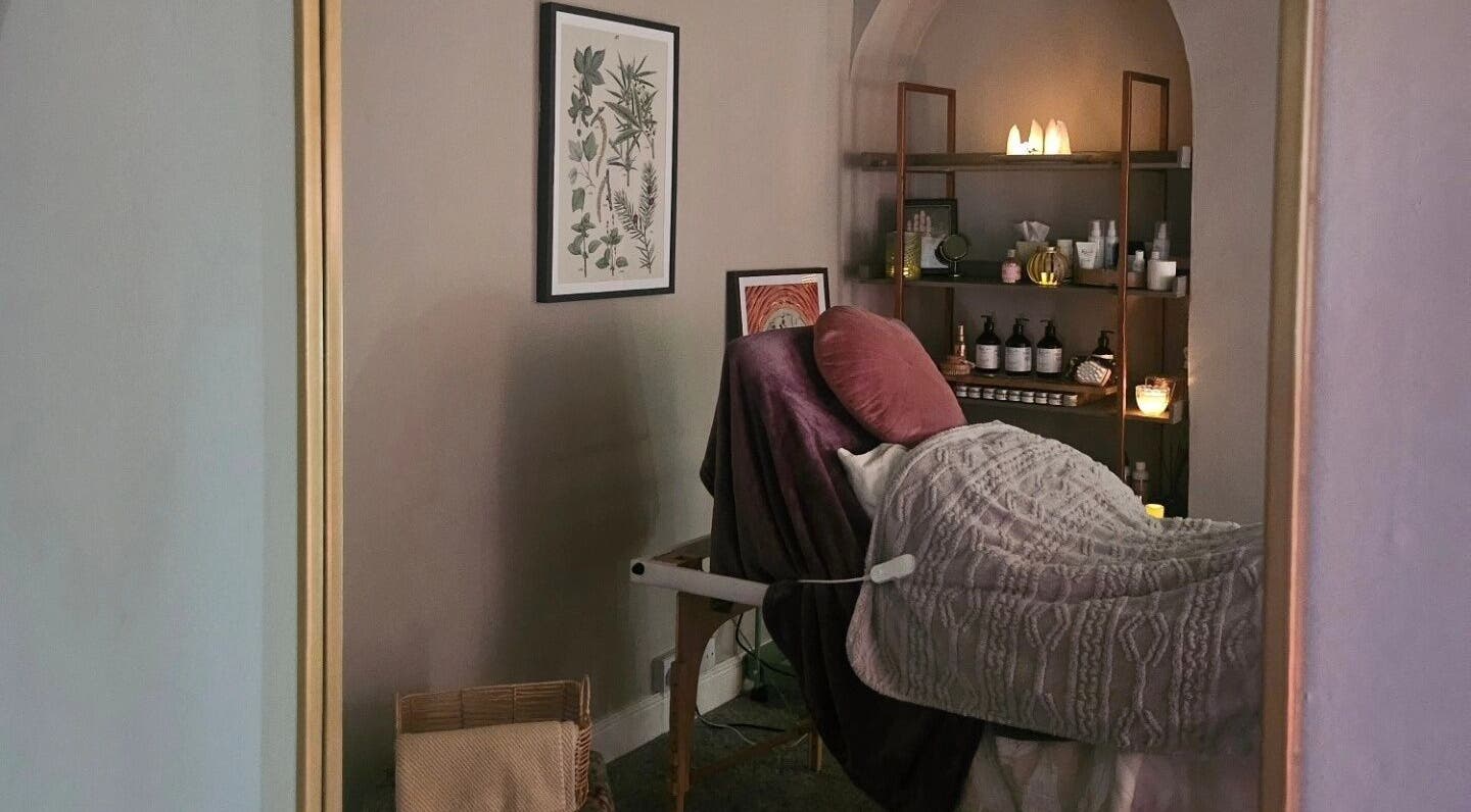 Cozy treatment room at Healing Hands with Alli, Grantham, England, GB, featuring a massage table and calming decor.