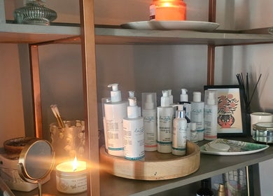 Wellness products on a shelf at Healing Hands with Alli, Grantham, England, GB, creating a tranquil atmosphere.