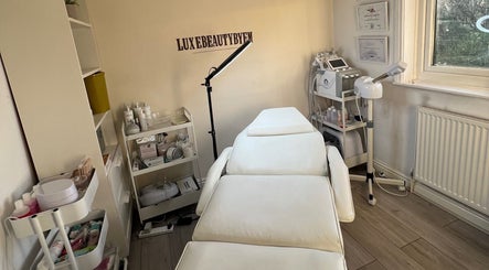 Relaxing treatment room at Luxebeautybyem in Manchester, England, GB, featuring modern spa equipment.