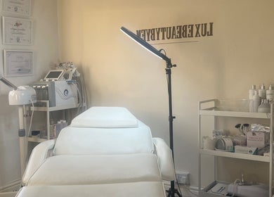 Luxebeautybyem's serene treatment room in Manchester, England, GB, featuring professional equipment.