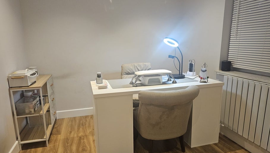 Modern nail desk at Xhensila Beauty Studio in Luton, England, GB, creating a serene atmosphere for beauty treatments.