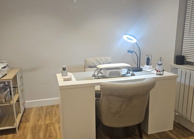Modern nail desk at Xhensila Beauty Studio in Luton, England, GB, creating a serene atmosphere for beauty treatments.