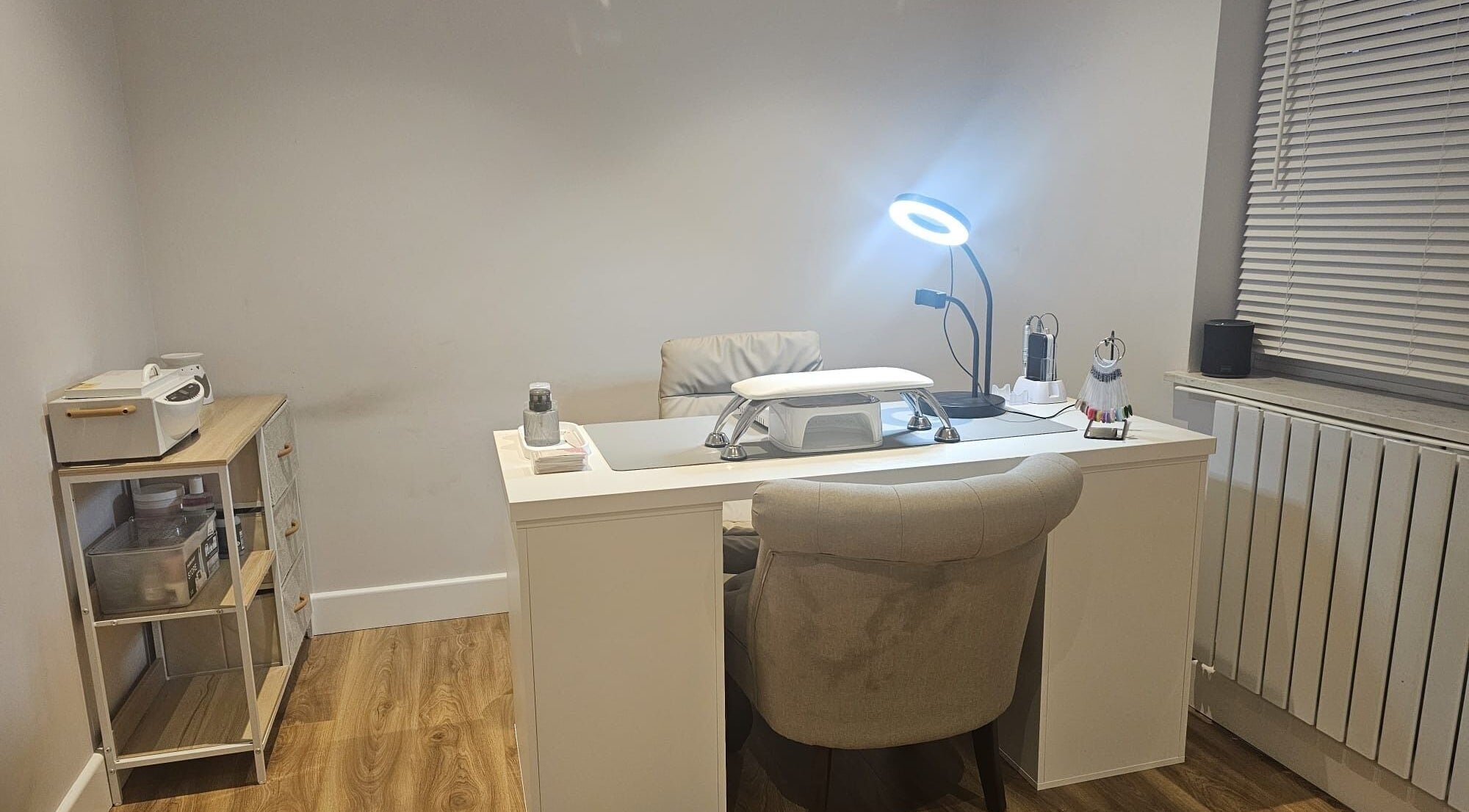 Modern nail desk at Xhensila Beauty Studio in Luton, England, GB, creating a serene atmosphere for beauty treatments.