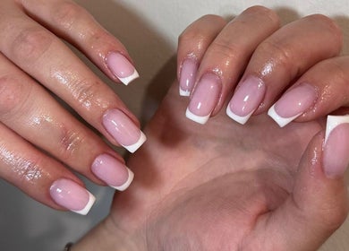 Elegant French manicure at Xhensila Beauty Studio, Luton, England, GB. Perfectly polished nails in a stylish fashion.