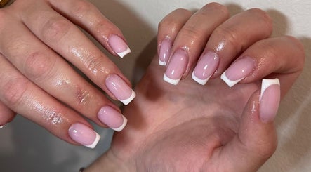 Elegant French manicure at Xhensila Beauty Studio, Luton, England, GB. Perfectly polished nails in a stylish fashion.