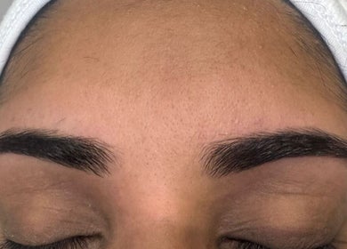 Perfectly shaped eyebrows at Sukhi Beauty Salon, London, England, GB showcasing precision beauty.