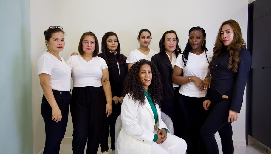 Cynthilante Beauty Salon team posing in Dubai, Dubai, AE, showcasing diverse staff in professional attire.