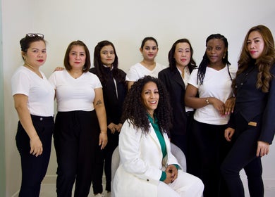 Cynthilante Beauty Salon team posing in Dubai, Dubai, AE, showcasing diverse staff in professional attire.