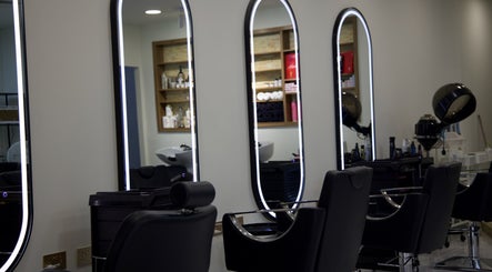 Sleek styling stations at Cynthilante Beauty Salon, Dubai, Dubai, AE, showcasing modern salon chairs and mirrors.