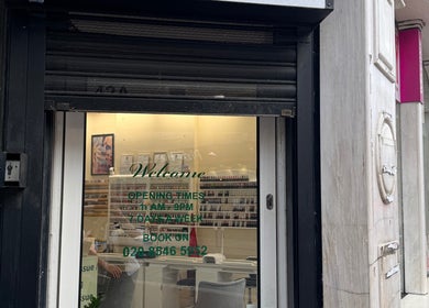 Entrance of Thai Yoga Massage Kingston with hours displayed, in Kingston Upon Thames, England, GB.