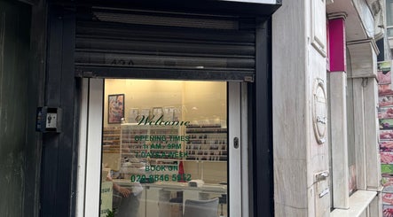 Entrance of Thai Yoga Massage Kingston with hours displayed, in Kingston Upon Thames, England, GB.