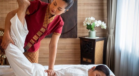 Therapist performing Thai yoga massage at Thai Yoga Massage Kingston, Kingston Upon Thames, England, GB.