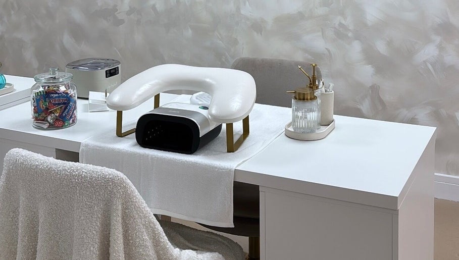 Elegant nail station setup at By Nicole Victoria, Whitworth, England, GB, featuring a manicure chair and tools.