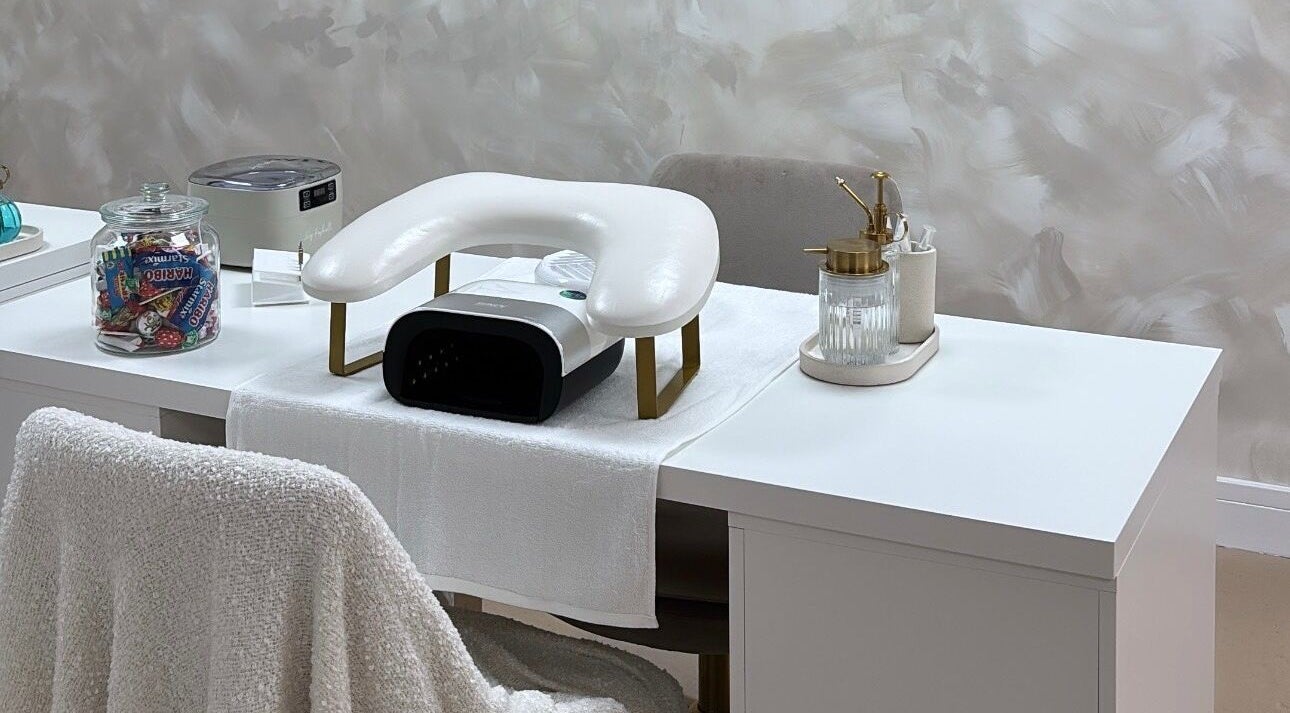 Elegant nail station setup at By Nicole Victoria, Whitworth, England, GB, featuring a manicure chair and tools.