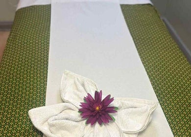 Relaxing massage table with flower at Watsana D Thai Massage - Watford in Watford, England, GB.