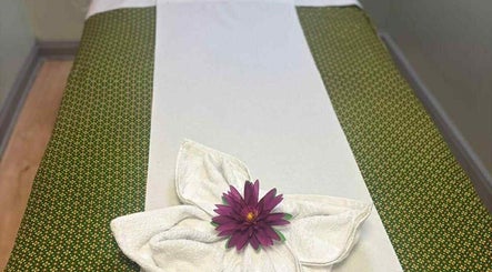 Relaxing massage table with flower at Watsana D Thai Massage - Watford in Watford, England, GB.