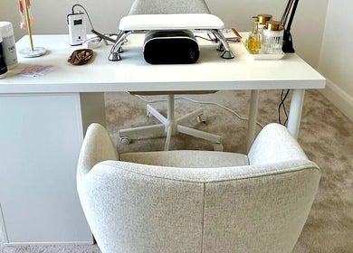 Elegant nail station at ZB NAILSTUDIO, Galway, County Galway, IE with modern decor and luxurious seating.