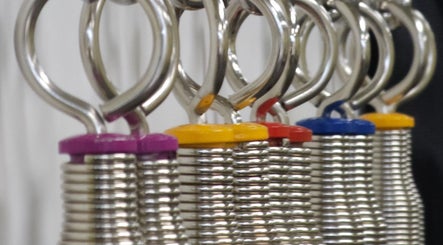 Close-up of colorful springs at Pilates for Fitness, Jacksonville, Florida, US, enhancing workout diversity.