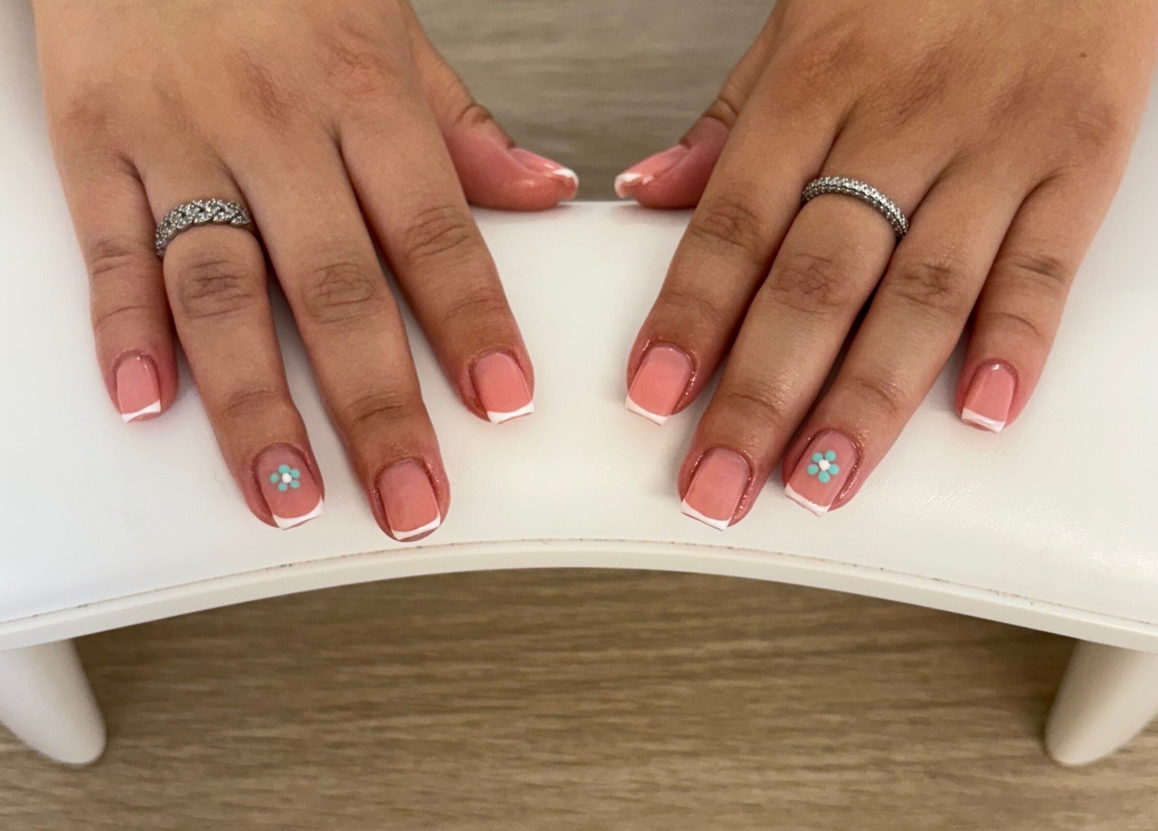 Floral nail art design at Beck’s Nails - Beauty in Gillingham, England, GB. Stylish pink with white tips.
