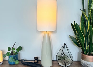Elegant lamp and greenery decor at Natural Body Massage, Glasgow, Scotland, GB, enhancing a calming ambiance.