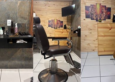 Interior do Bruno Santos Barbershop em Minas Gerais, BR. Destaca-se uma cadeira de barbeiro vintage e decoração rústica.