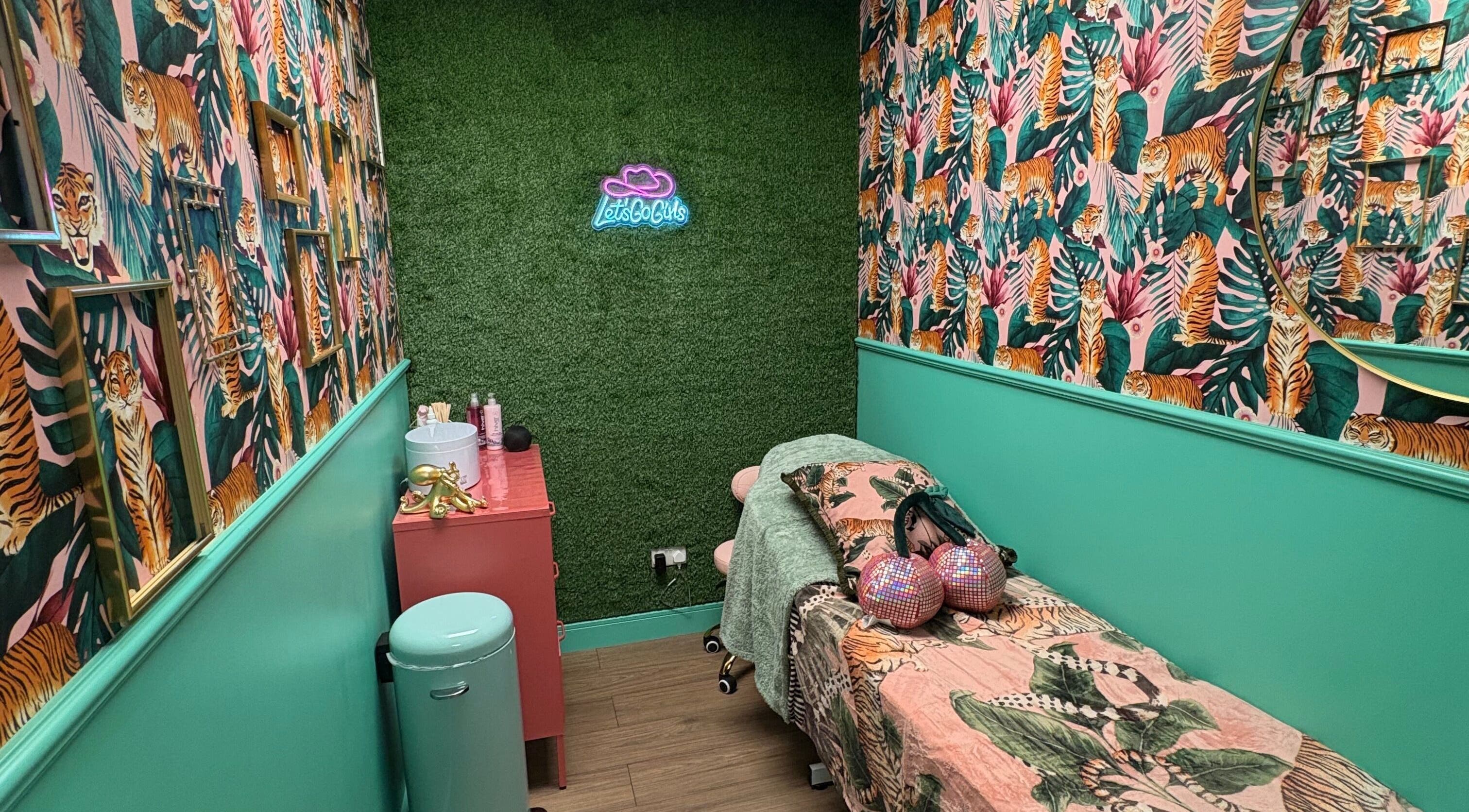 Bright and colorful treatment room at The Little Beauty Cabin, Hadston, England, GB with tiger-themed decor.