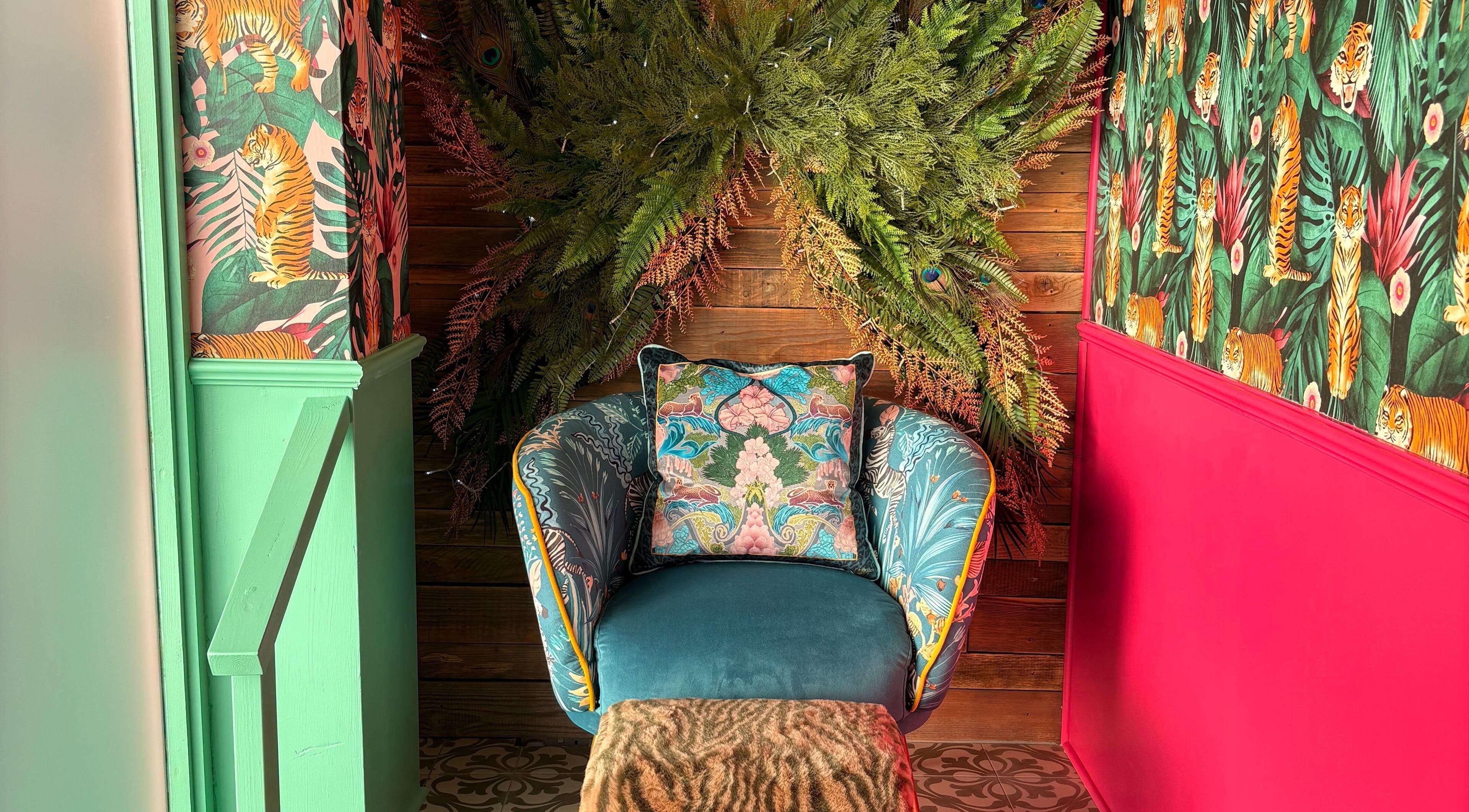 Vibrant chair with tropical décor at The Little Beauty Cabin, Hadston, England, GB.