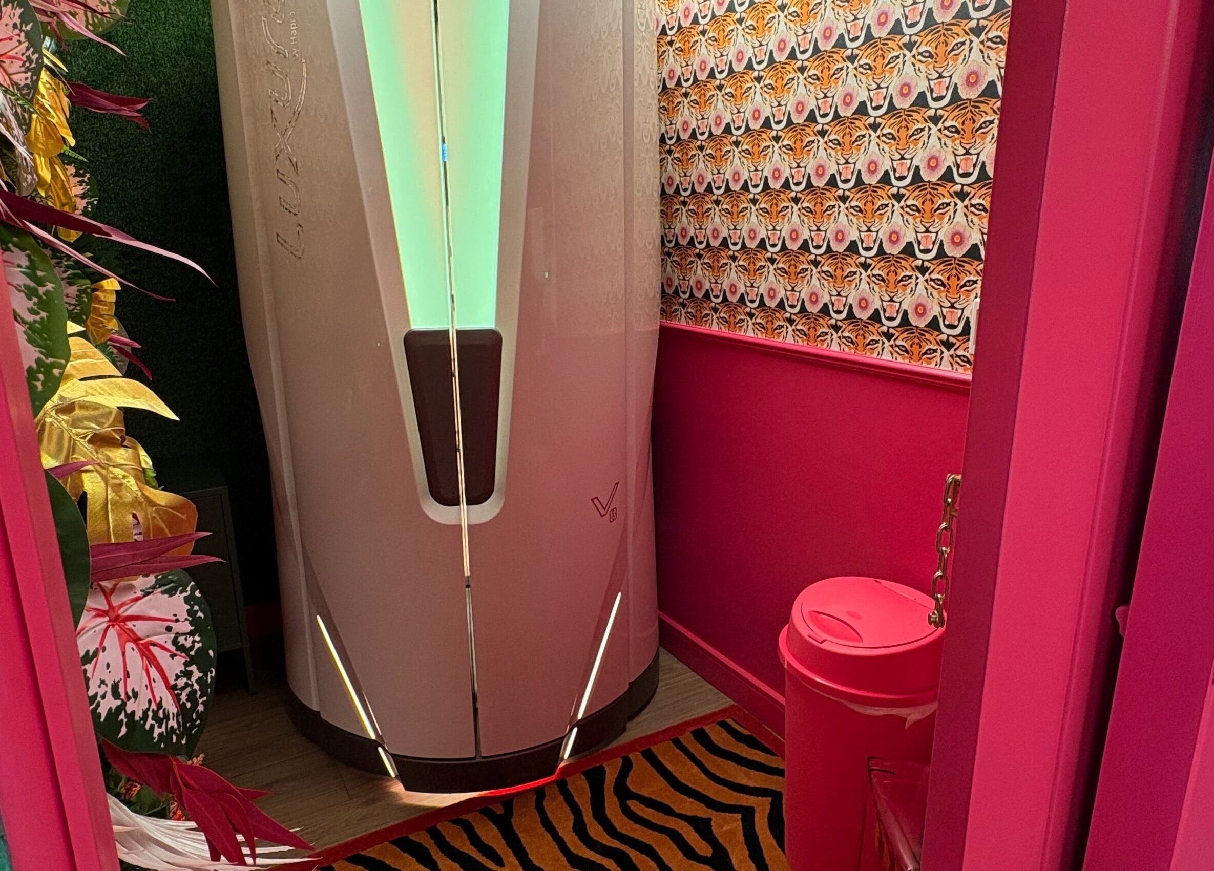 Stylish room with tanning booth at The Little Beauty Cabin, Hadston, England, GB.