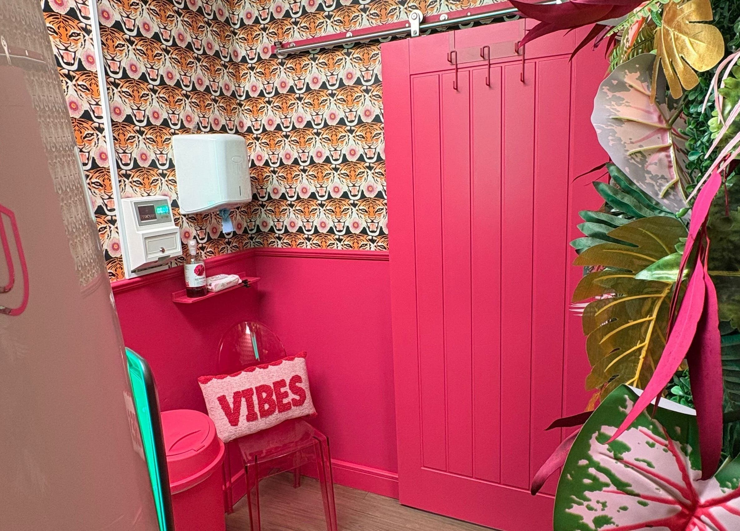 Vibrant interior of The Little Beauty Cabin, Hadston, England, GB. Featuring colorful decor and lush plants.