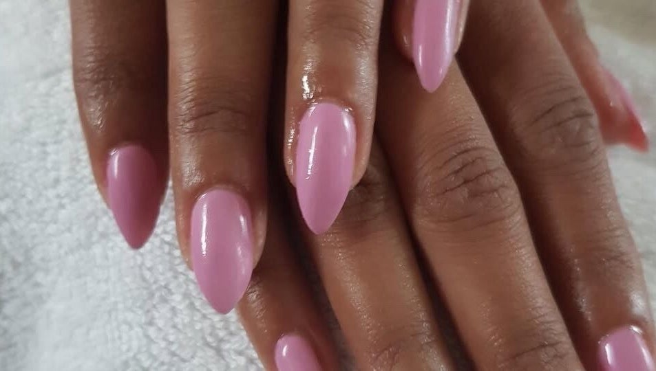 Elegant pink nails manicure at The Bare beauty - Waxing Studio, London, England, GB emphasizing nail art service.