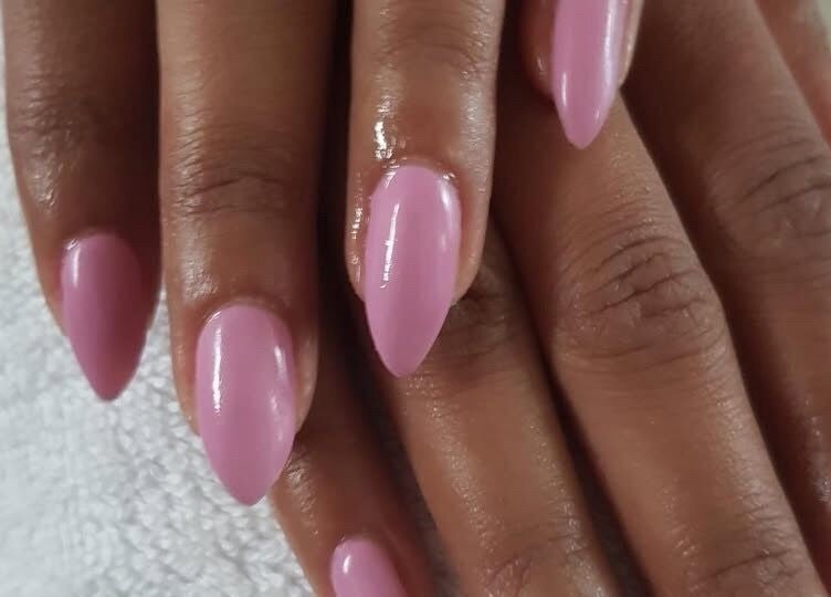 Elegant pink nails manicure at The Bare beauty - Waxing Studio, London, England, GB emphasizing nail art service.