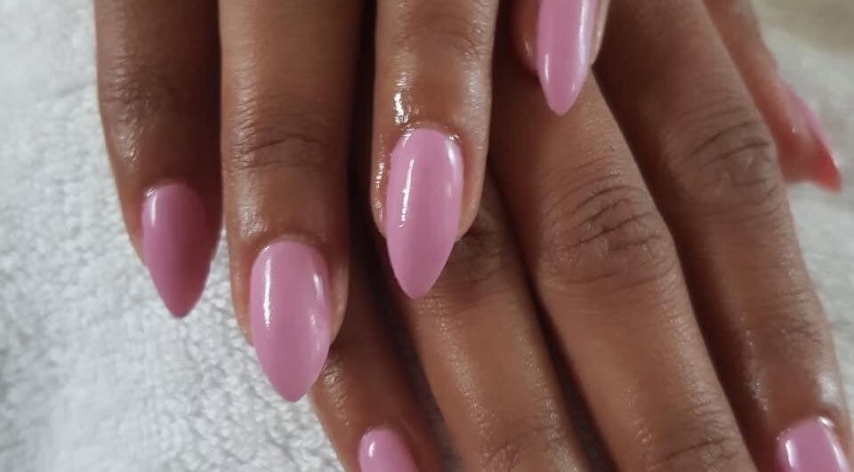 Elegant pink nails manicure at The Bare beauty - Waxing Studio, London, England, GB emphasizing nail art service.