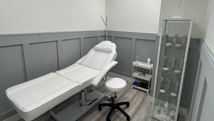 Elegant treatment room at Aceso Aesthetics, Northwich, England, GB featuring a modern therapy bed.
