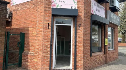 Entrance of Aceso Aesthetics in Northwich, England, GB, showcasing brick exterior and welcoming doorway.