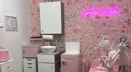 Pink Studio Miami's chic space with floral wall and pink decor in Miami, Florida, US.