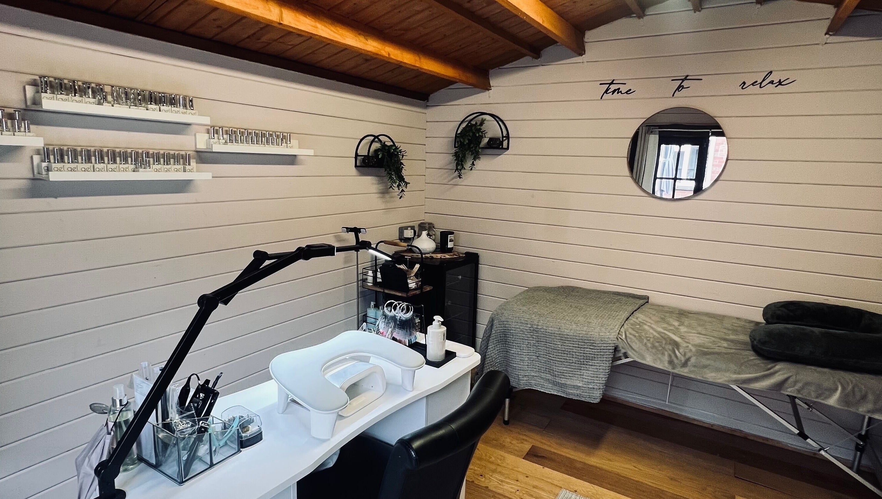 Relaxing spa setup at Allthingsbeauty_bykatiex in Pershore, England, GB featuring a manicure station and massage bed.