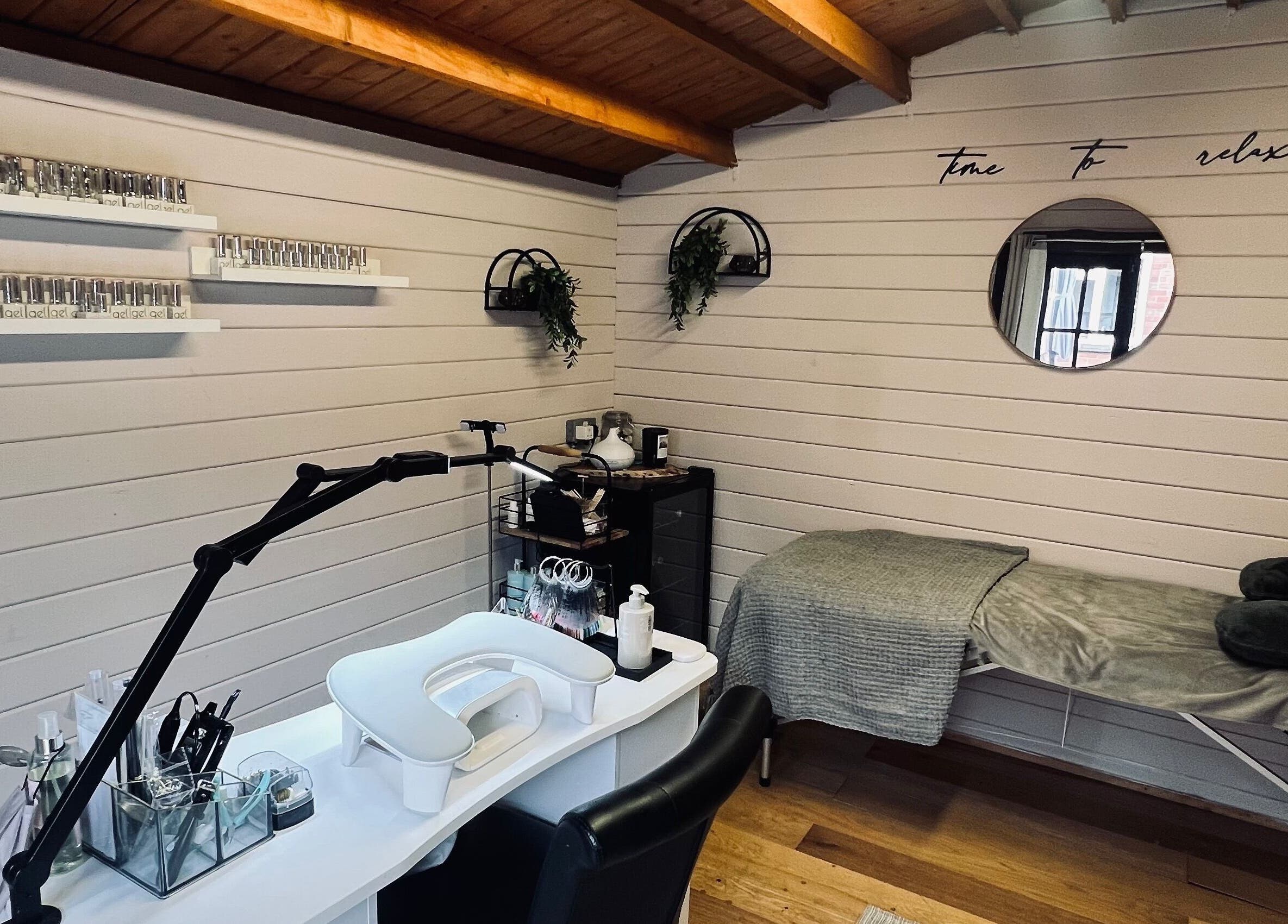 Relaxing spa setup at Allthingsbeauty_bykatiex in Pershore, England, GB featuring a manicure station and massage bed.