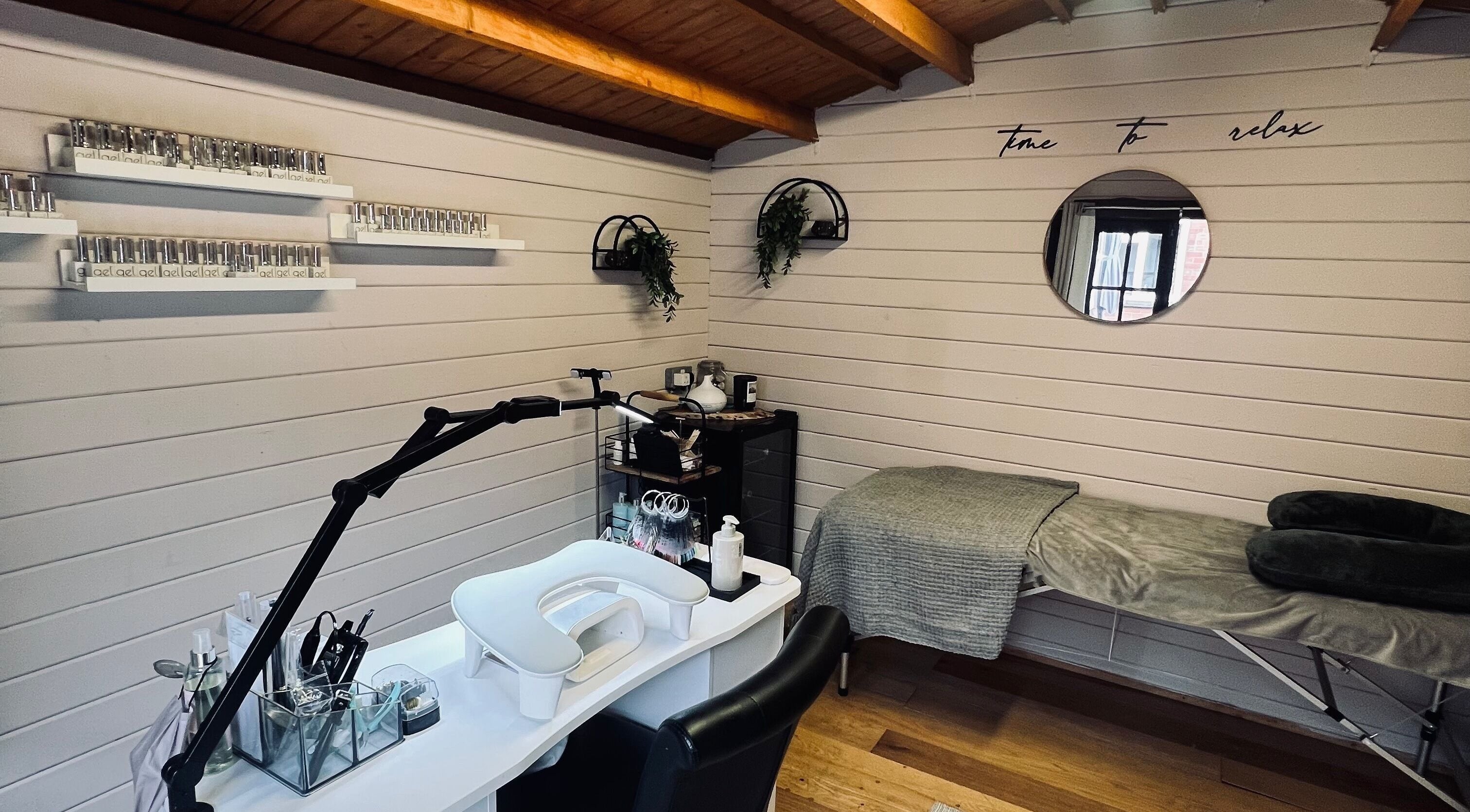 Relaxing spa setup at Allthingsbeauty_bykatiex in Pershore, England, GB featuring a manicure station and massage bed.