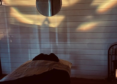 Tranquil treatment room at Allthingsbeauty_bykatiex, Pershore, England, GB lit by soothing ambient lighting.