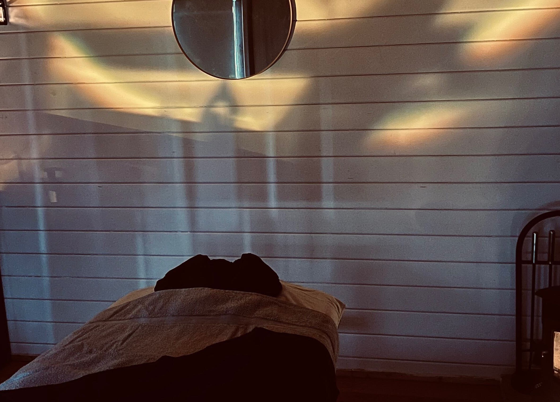 Tranquil treatment room at Allthingsbeauty_bykatiex, Pershore, England, GB lit by soothing ambient lighting.