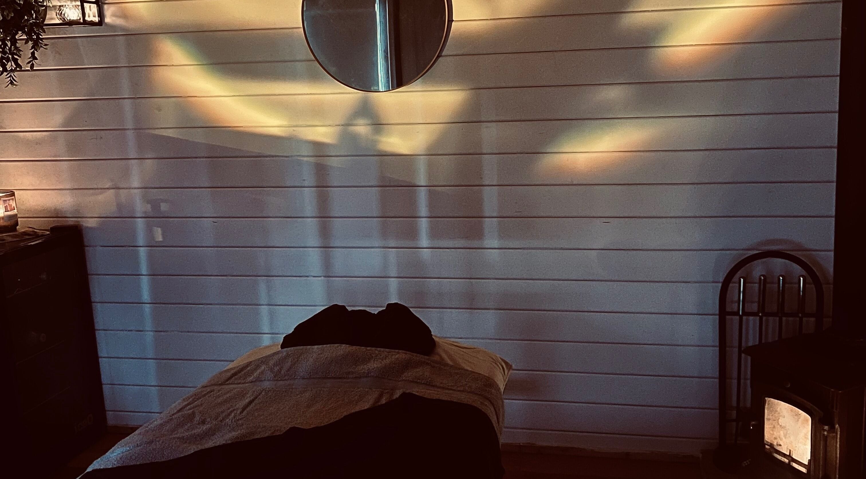 Tranquil treatment room at Allthingsbeauty_bykatiex, Pershore, England, GB lit by soothing ambient lighting.