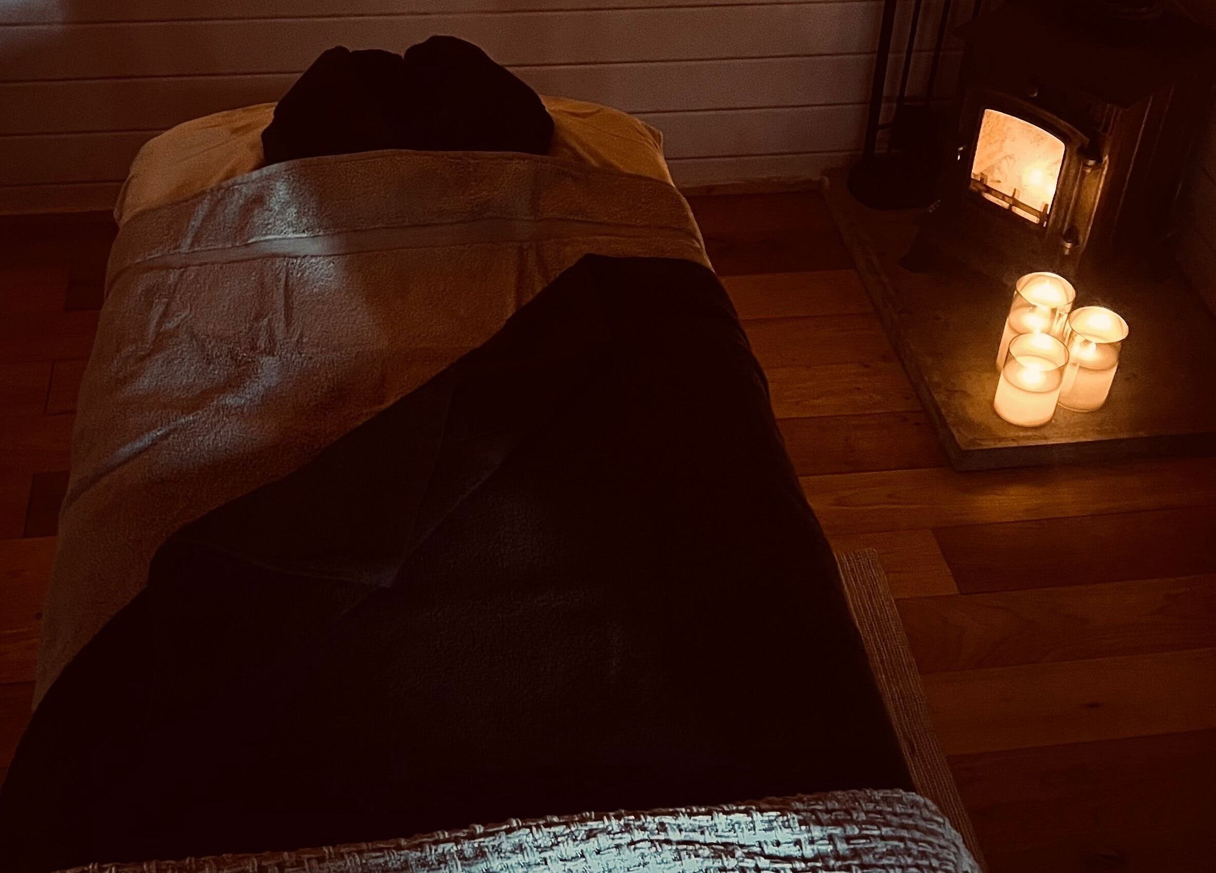 Relaxing spa bed with candles at Allthingsbeauty_bykatiex, Pershore, England, GB for ultimate tranquility.